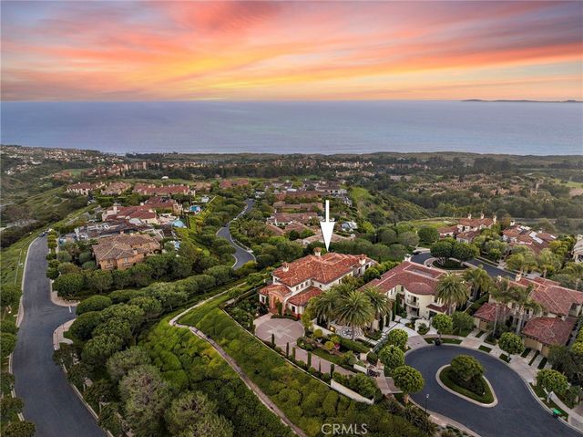 an aerial view of residential houses with outdoor space and river