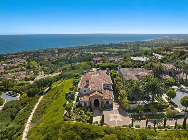 a living room with furniture fireplace and large windows