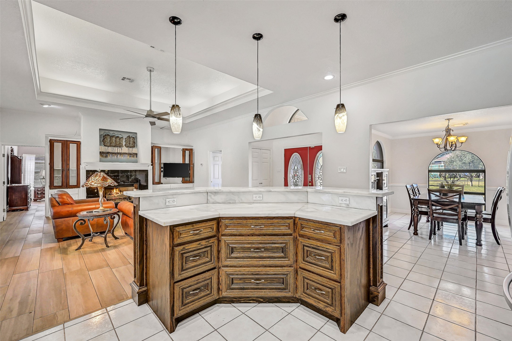 4721 Willow Street Pasadena, TX 77586 - Photo 11 of 31 a kitchen with stainless steel appliances kitchen island granite countertop a stove a sink a dining table and chairs with wooden floor
