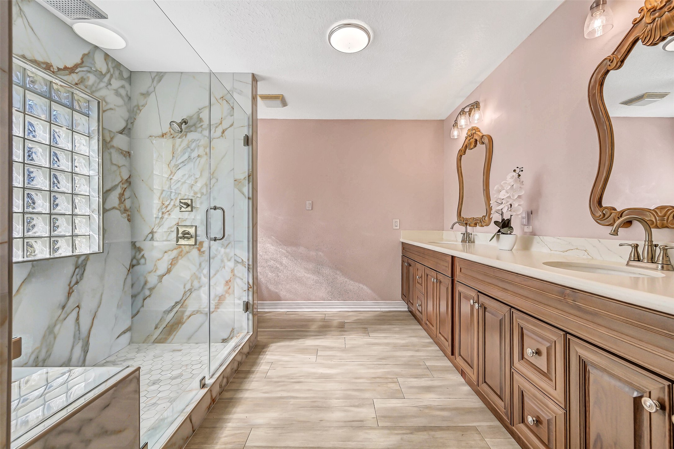 4721 Willow Street Pasadena, TX 77586 - Photo 16 of 30 a bathroom with double vanity and a shower