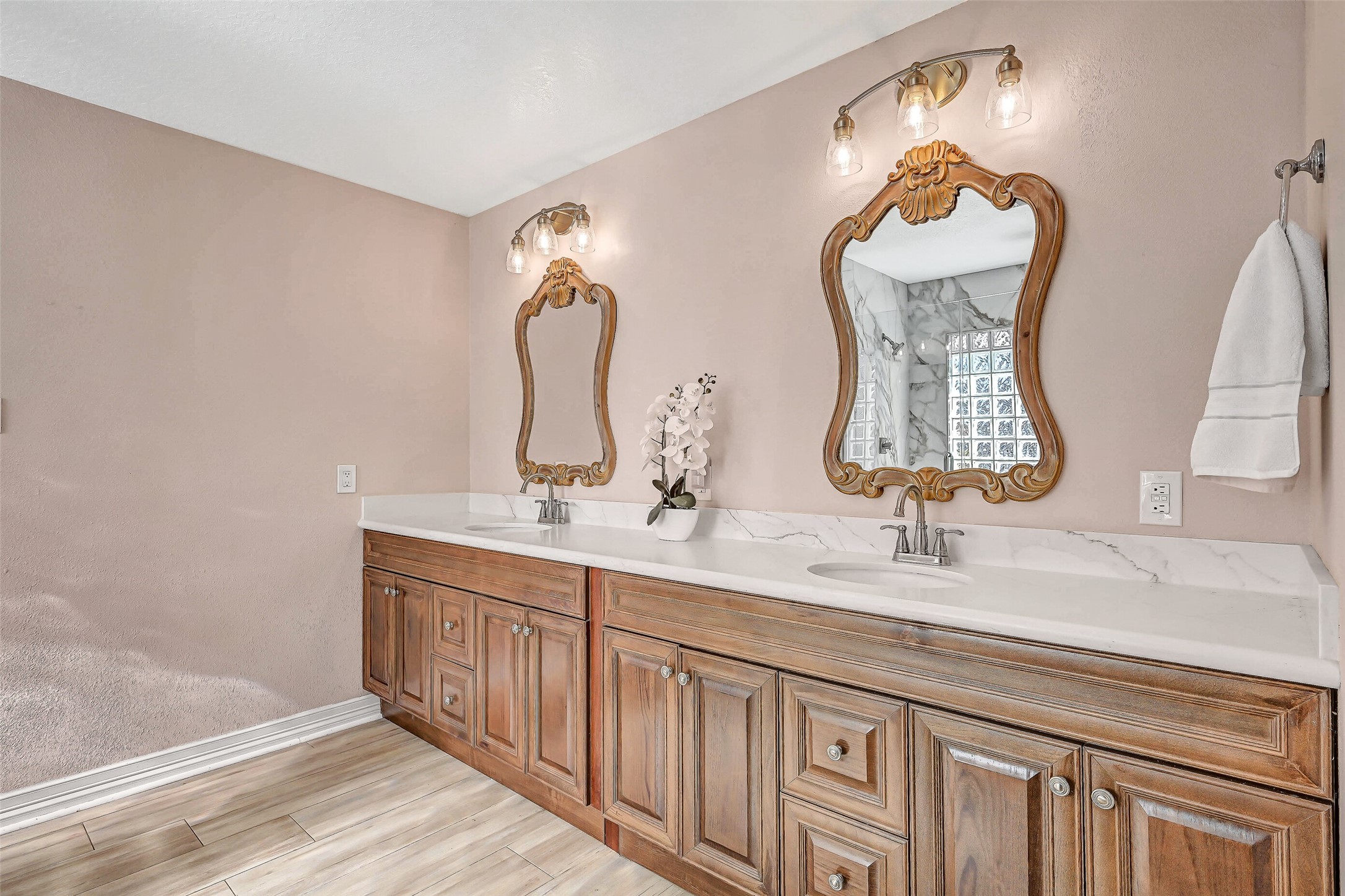 4721 Willow Street Pasadena, TX 77586 - Photo 17 of 30 a bathroom with double vanity sinks and a mirror