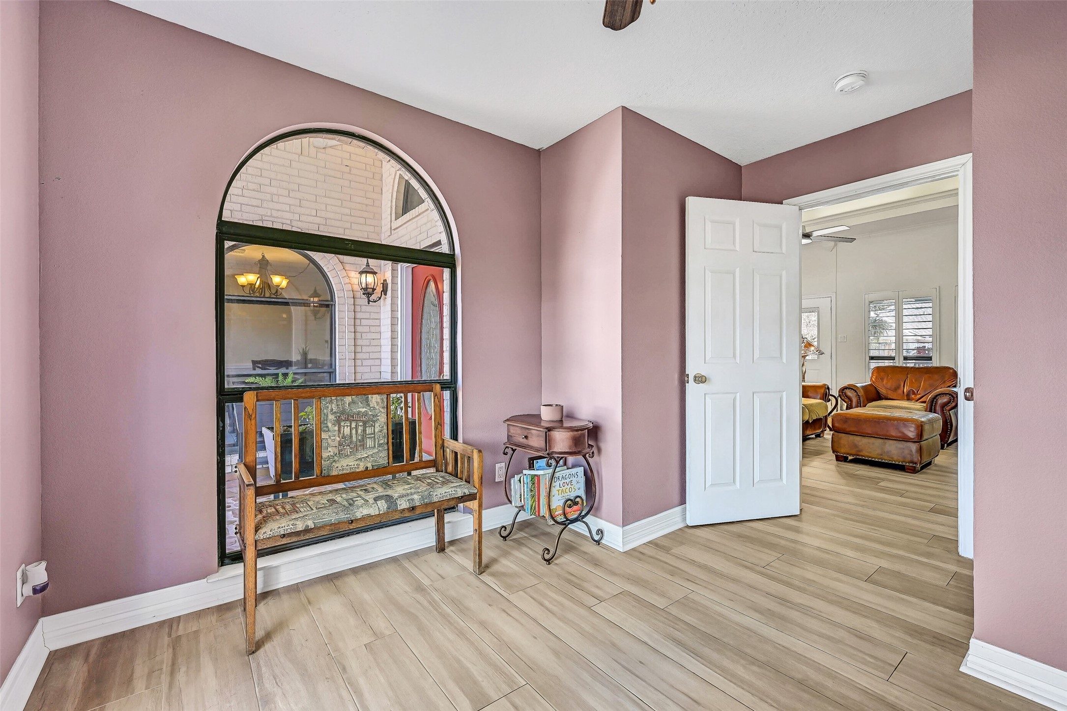 4721 Willow Street Pasadena, TX 77586 - Photo 21 of 31 a bedroom with furniture and a wooden floor