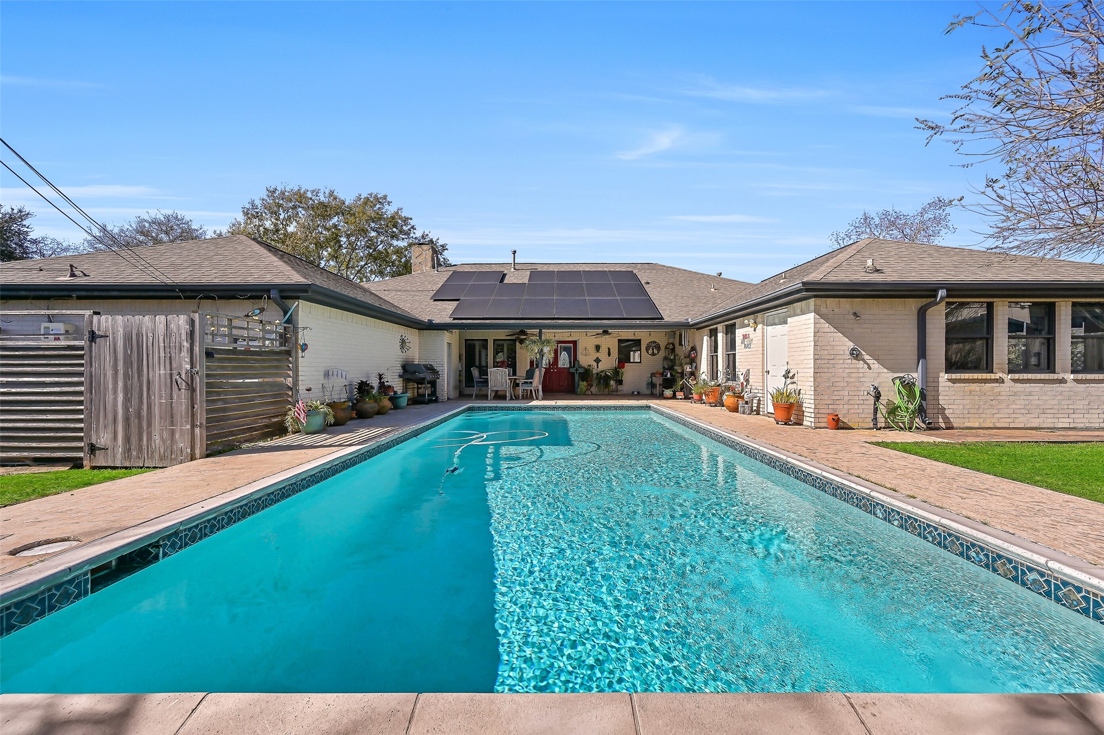 4721 Willow Street Pasadena, TX 77586 - Photo 28 of 30 swimming pool view with a seating space and a garden view