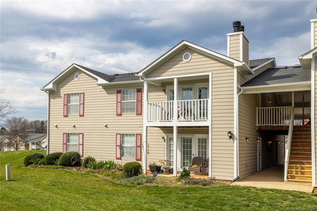5523 Hornaday Road, Unit G Greensboro, NC 27409 - Photo 2 of 20 a front view of a house with a yard