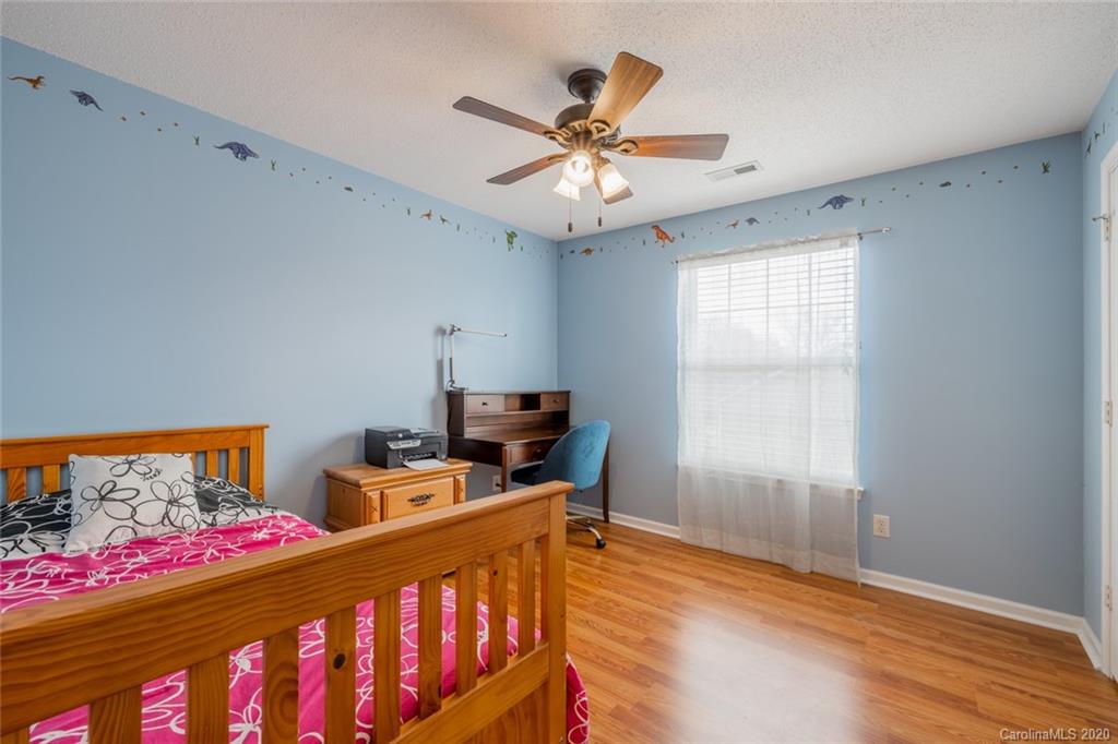 5523 Hornaday Road, Unit G Greensboro, NC 27409 - Photo 11 of 20 a bedroom with furniture and a window