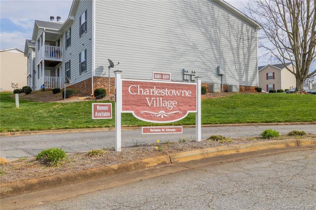 5523 Hornaday Road, Unit G Greensboro, NC 27409 - Photo 20 of 20 a sign on the side of a building