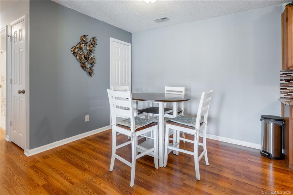 5523 Hornaday Road, Unit G Greensboro, NC 27409 - Photo 9 of 20 a view of a room with wooden floor and staircase