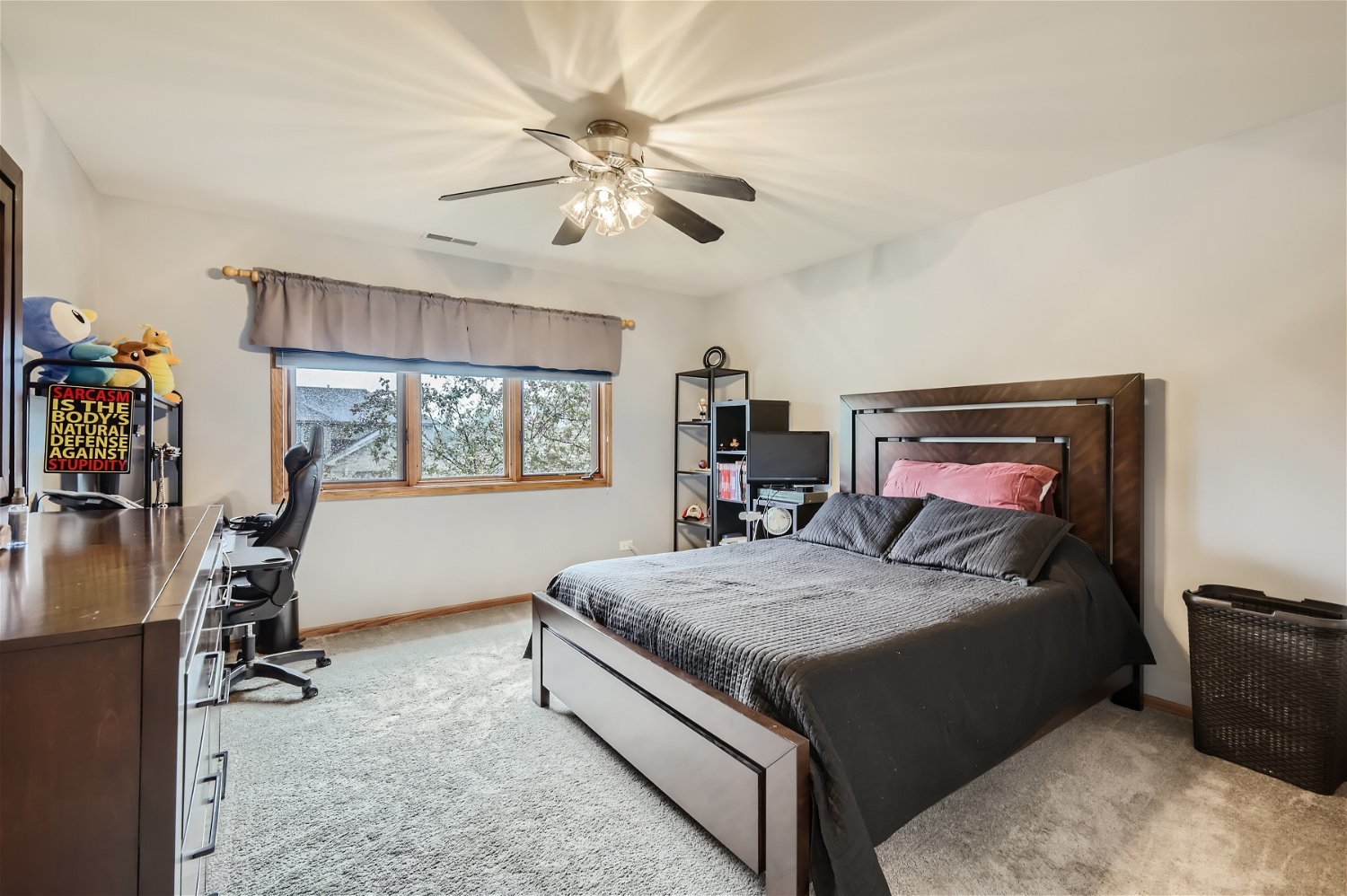 18255 Cork Road Tinley Park, IL 60477 - Photo 19 of 29 a bedroom with a bed and a chandelier