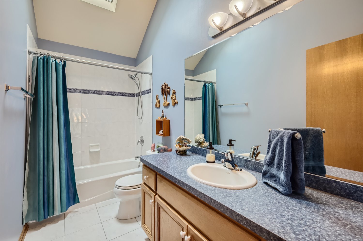 18255 Cork Road Tinley Park, IL 60477 - Photo 22 of 29 a bathroom with a granite countertop sink a toilet a mirror and shower