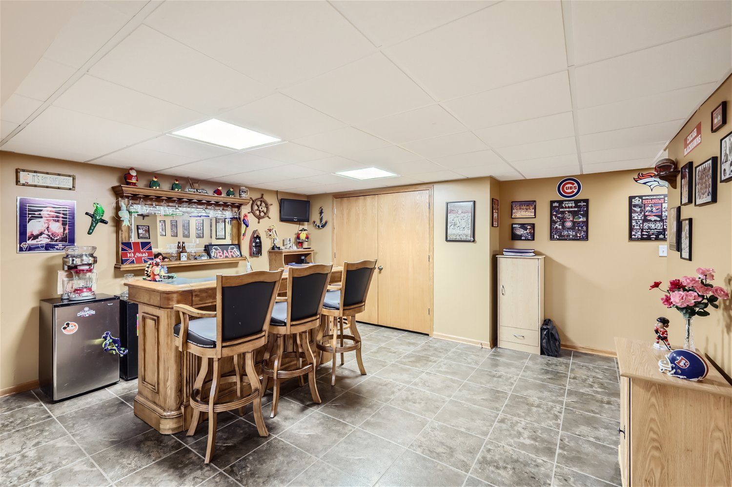 18255 Cork Road Tinley Park, IL 60477 - Photo 25 of 29 a dining room with furniture and a kitchen view