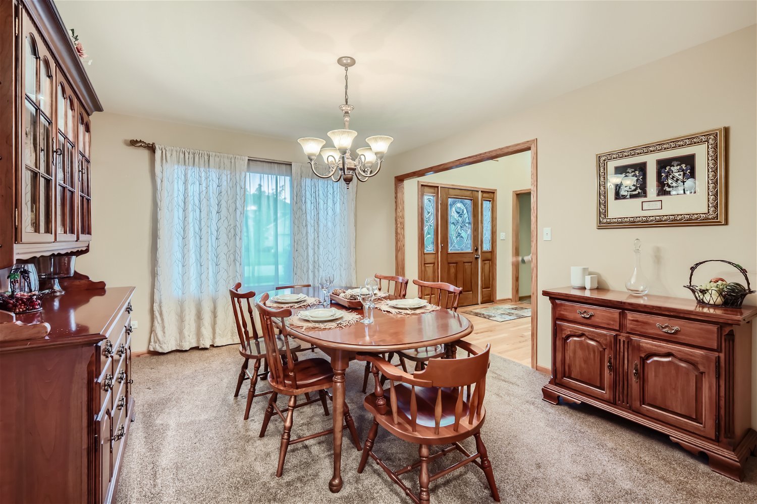 18255 Cork Road Tinley Park, IL 60477 - Photo 5 of 29 a view of a dining room with furniture and chandelier