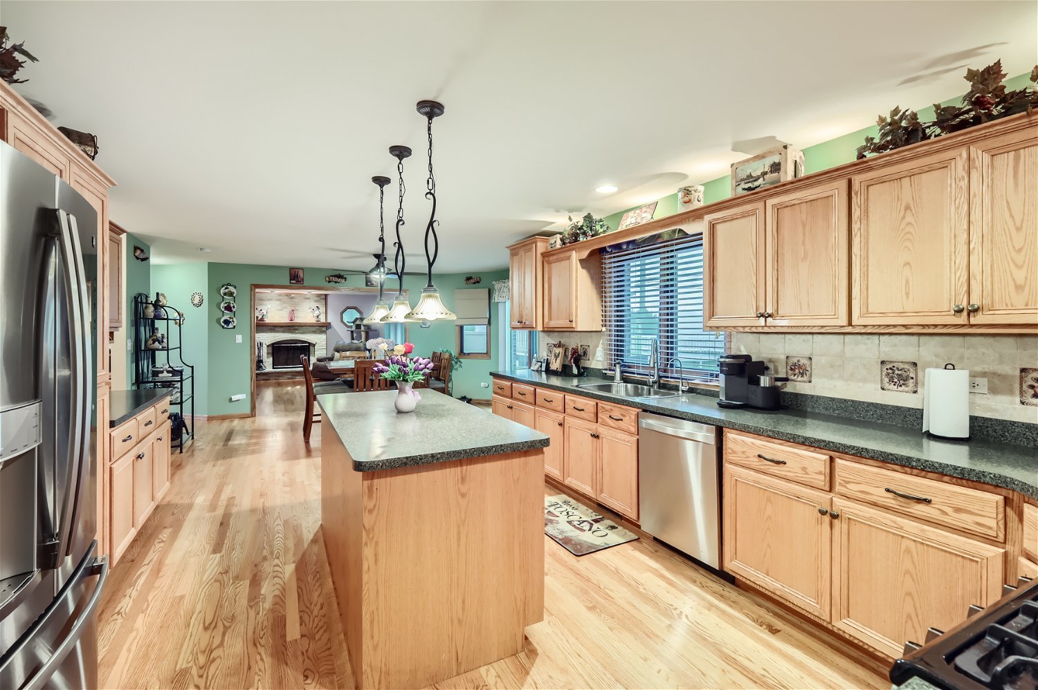 18255 Cork Road Tinley Park, IL 60477 - Photo 9 of 29 a kitchen with stainless steel appliances granite countertop a sink stove and refrigerator