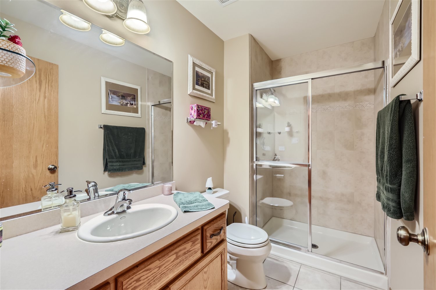 18255 Cork Road Tinley Park, IL 60477 - Photo 10 of 29 a bathroom with a sink toilet and shower