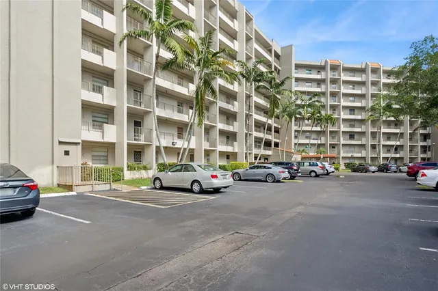 a view of a cars parked in front of a building