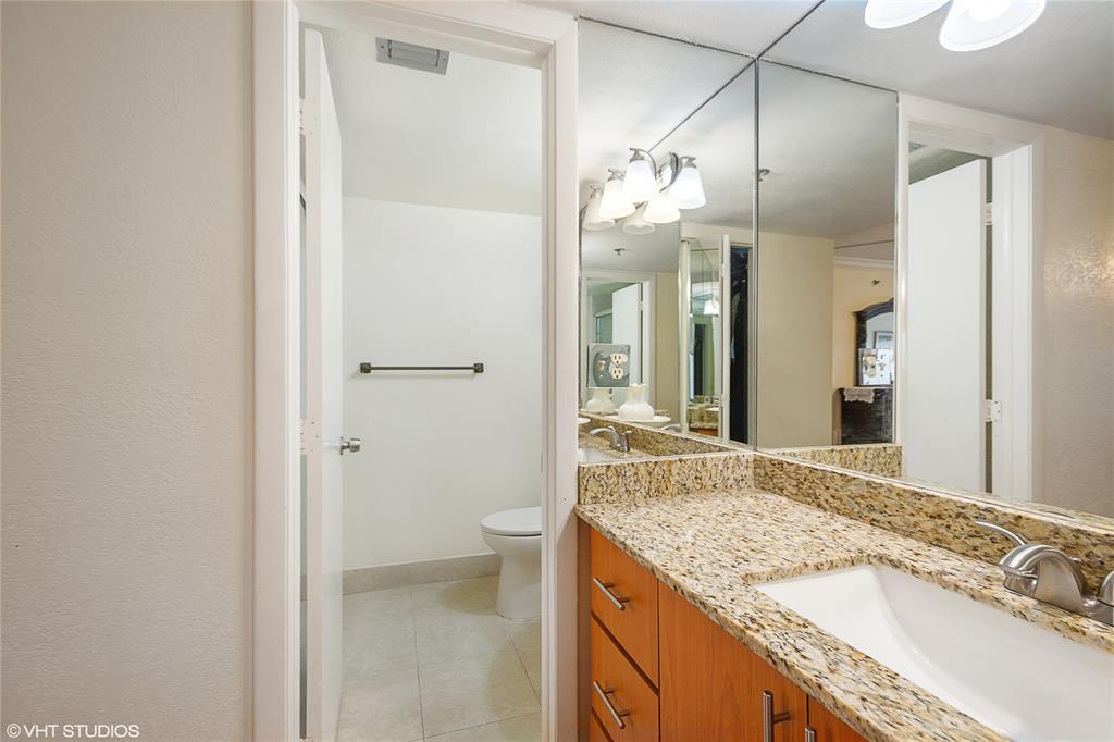 3940 Inverrary Boulevard, Unit 403A Lauderhill, FL 33319 - Photo 15 of 34 a bathroom with a granite countertop sink and a mirror