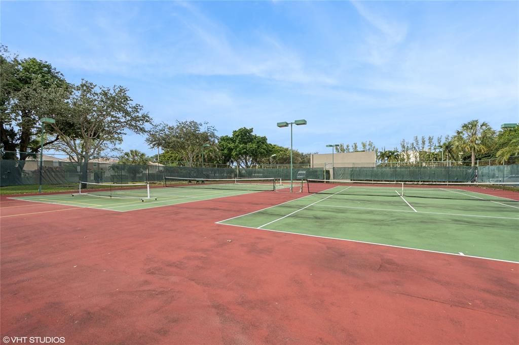 3940 Inverrary Boulevard, Unit 403A Lauderhill, FL 33319 - Photo 32 of 34 a view of a golf course with a lake