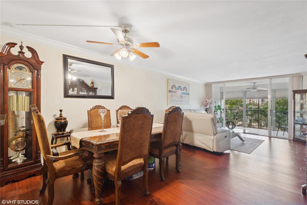 3940 Inverrary Boulevard, Unit 403A Lauderhill, FL 33319 - Photo 9 of 34 a view of a livingroom with furniture window and wooden floor
