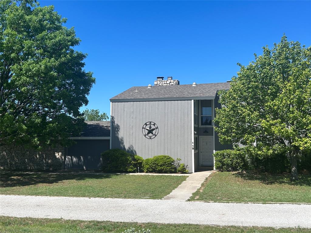13 Rim Rock Road Goldthwaite, TX 76844 - Photo 1 of 30 a front view of a house with garden