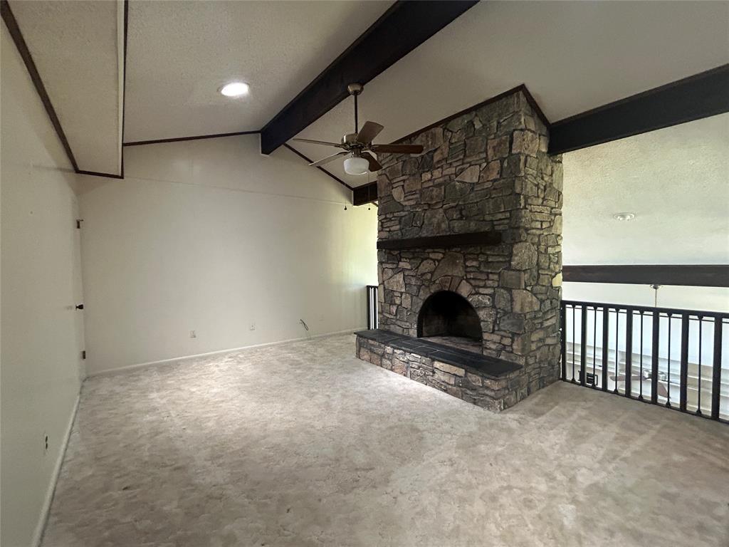 13 Rim Rock Road Goldthwaite, TX 76844 - Photo 12 of 30 a view of empty room with fireplace