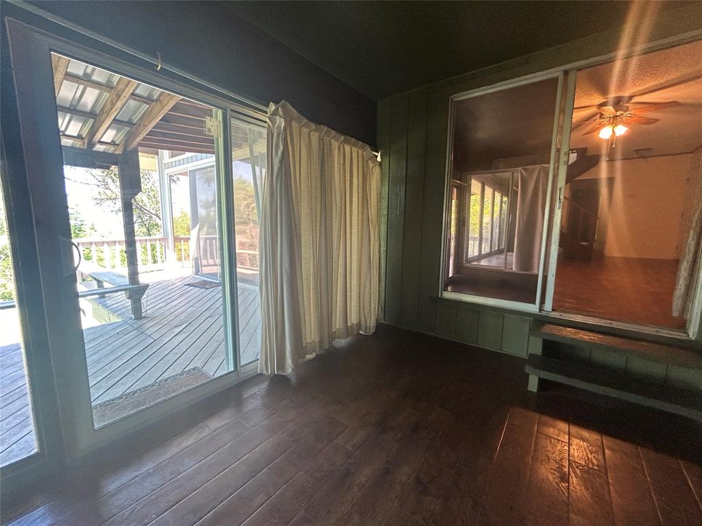 13 Rim Rock Road Goldthwaite, TX 76844 - Photo 17 of 30 a view of hallway with windows and wooden floor