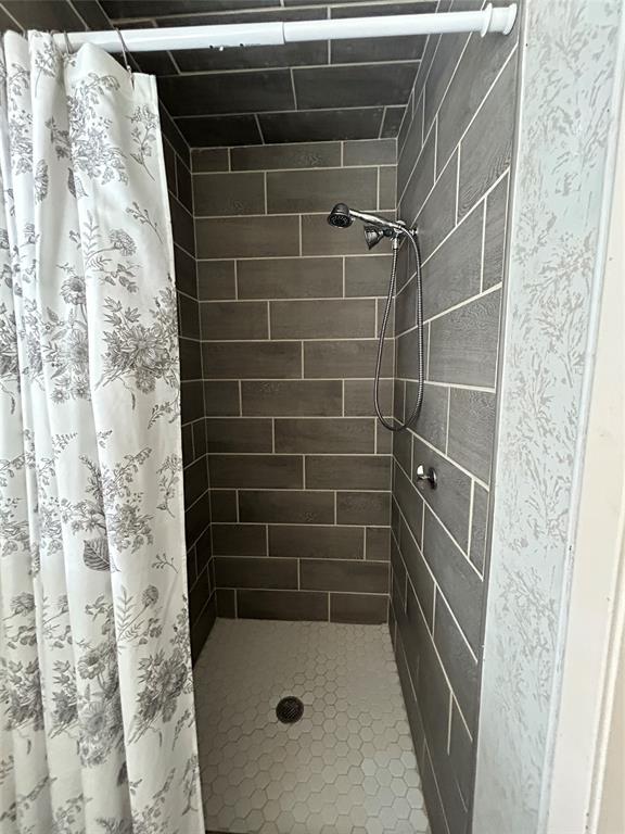 13 Rim Rock Road Goldthwaite, TX 76844 - Photo 20 of 30 a bathroom with a shower