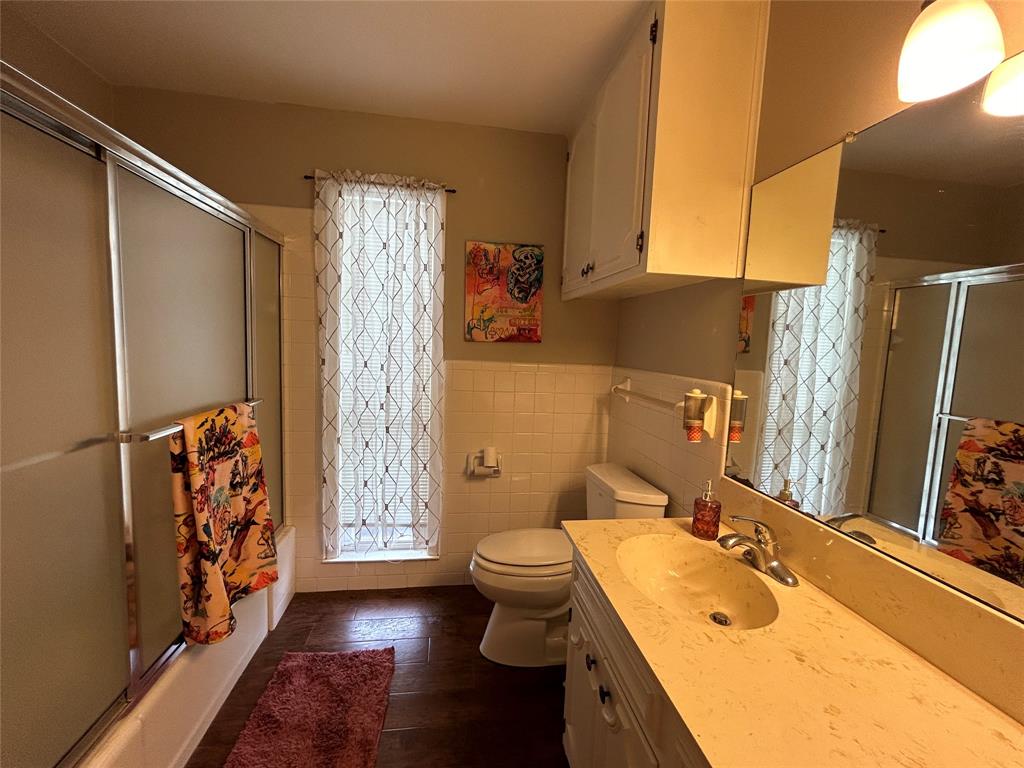 13 Rim Rock Road Goldthwaite, TX 76844 - Photo 22 of 30 a bathroom with a granite countertop sink toilet and shower