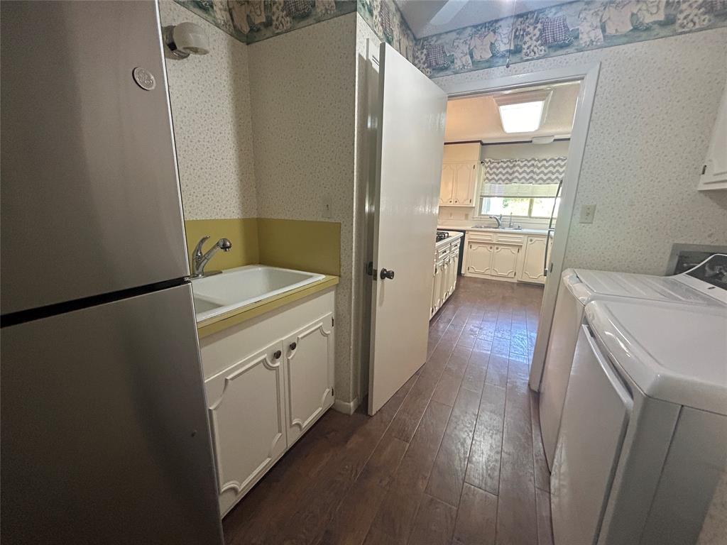 13 Rim Rock Road Goldthwaite, TX 76844 - Photo 25 of 30 a room with a sink and wooden floor