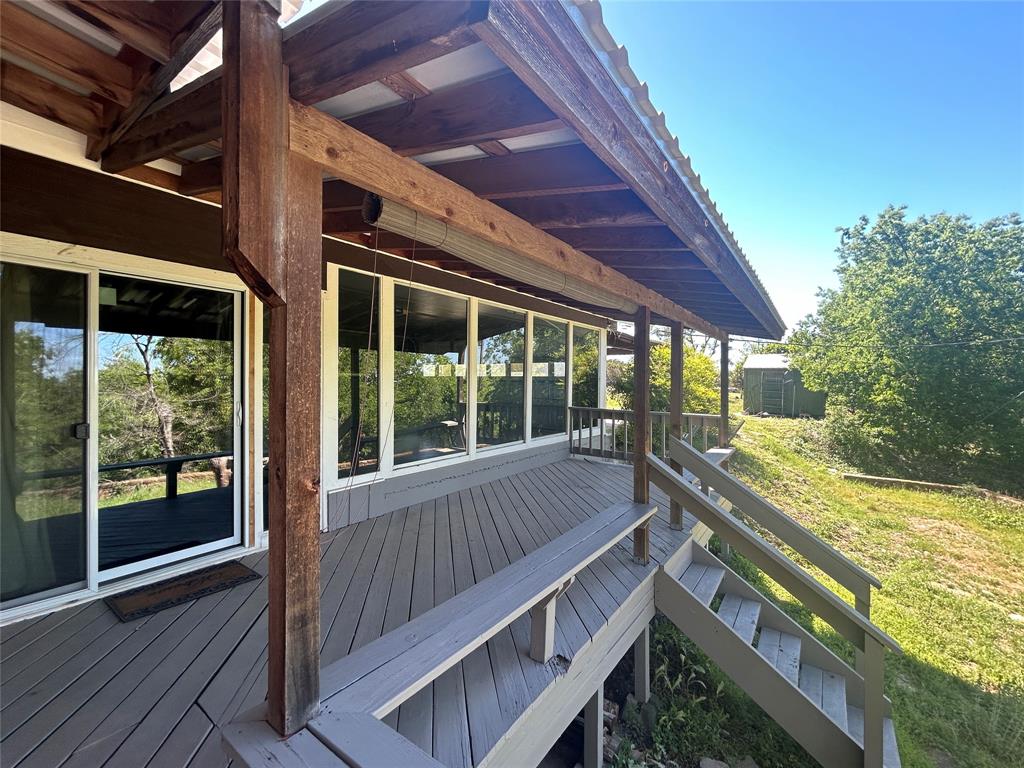 13 Rim Rock Road Goldthwaite, TX 76844 - Photo 27 of 30 a view of balcony with couch and wooden floor