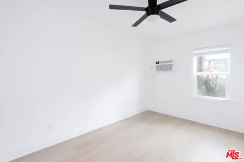 a view of an empty room and a window