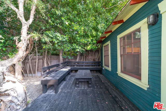 a view of a backyard with sitting area