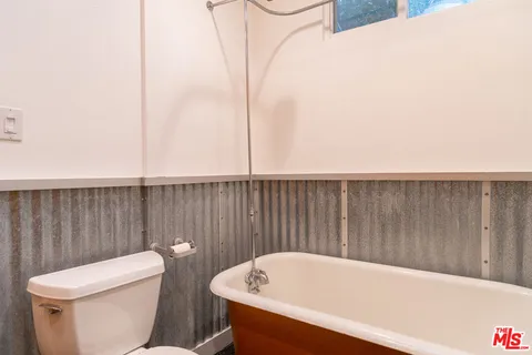 a bathroom with a sink and toilet