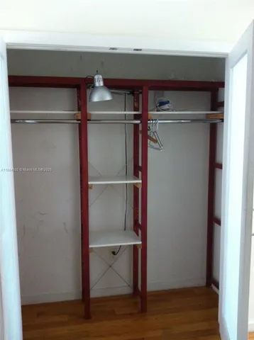 a white stove top oven sitting inside of a kitchen