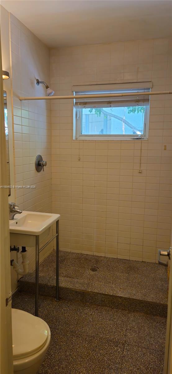 745 13th Street, Unit 16 Miami Beach, FL 33139 - Photo 26 of 27 a bathroom with a sink a toilet and shower