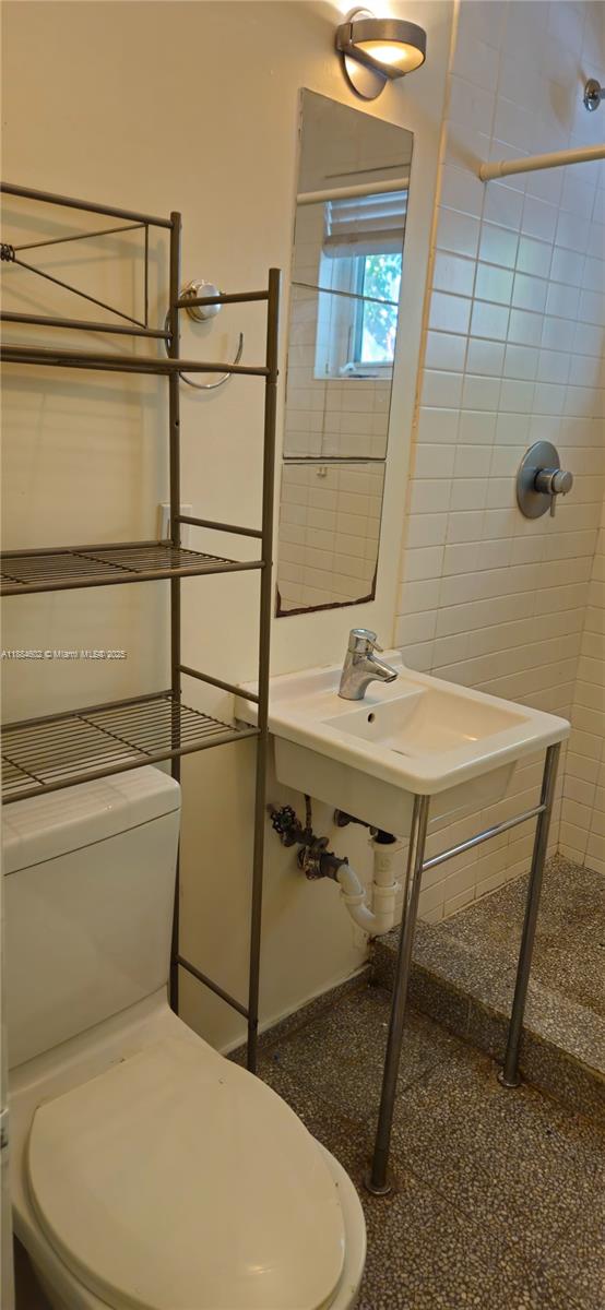 745 13th Street, Unit 16 Miami Beach, FL 33139 - Photo 27 of 27 a bathroom with a sink toilet and shower