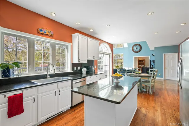 a kitchen with a stove a sink and a refrigerator