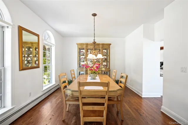 a dining room with furniture window wooden floor
