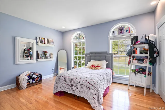 a bedroom with bed and a window