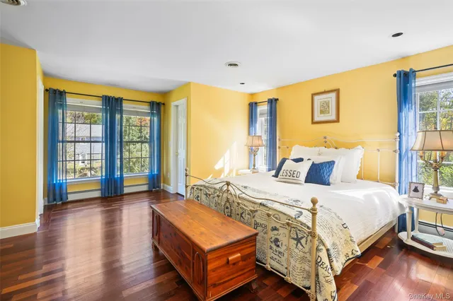 a bedroom with a bed and wooden furniture