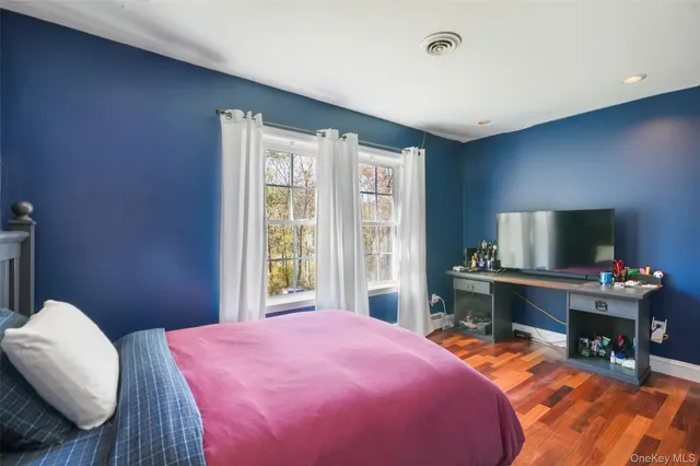 a bathroom with a double vanity sink mirror and toilet