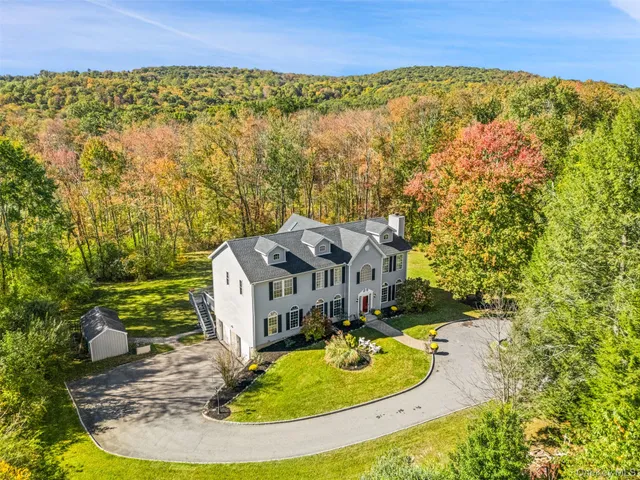 a view of a swimming pool with an outdoor seating