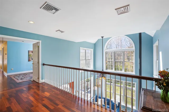 a view of entryway with wooden floor