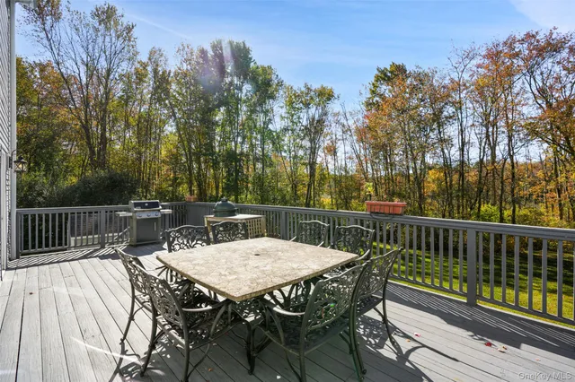 a view of balcony with deck and outdoor seating