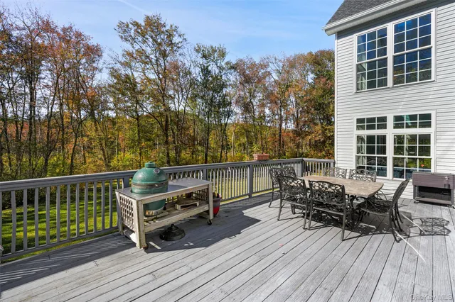 a view of a house with a swimming pool and a yard