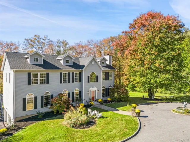 swimming pool with outdoor seating and yard