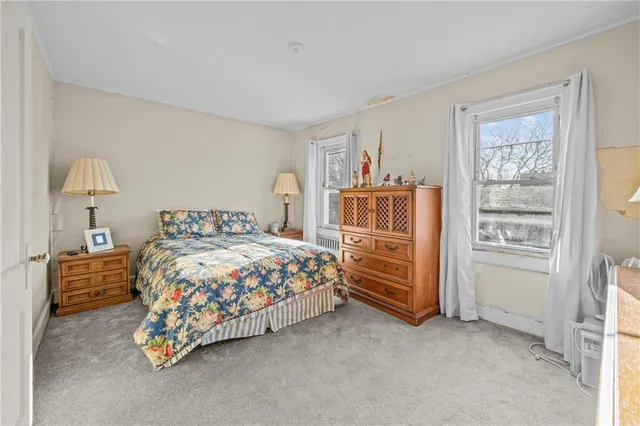a bedroom with a bed and a cabinets