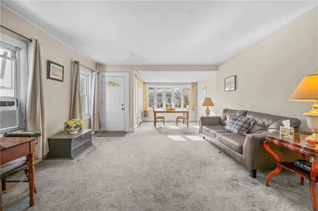 a living room with furniture and a table