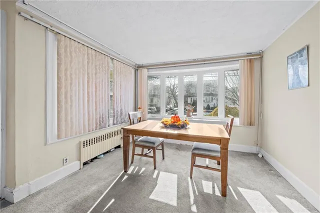 a room that has a table and chairs in it