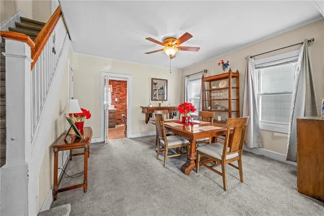 a view of a dining room with furniture and a window