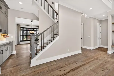 a view of an entryway with wooden floor