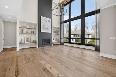 a view of a livingroom with furniture and hardwood floor